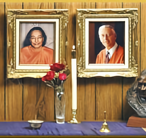 Table adorned with flowers and photos in remembrance of Paramahansa Yogananda and Roy Eugene Davis